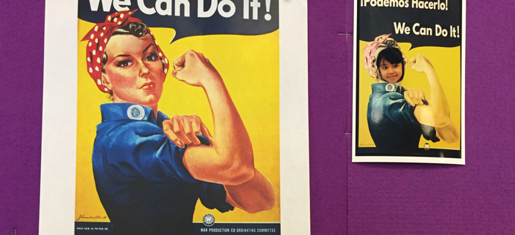 Girls posed as Rosie the Riveter